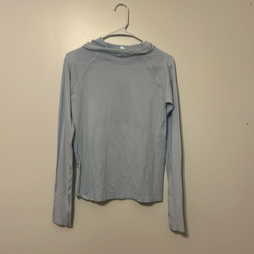 Hooded long sleeve athletic top.